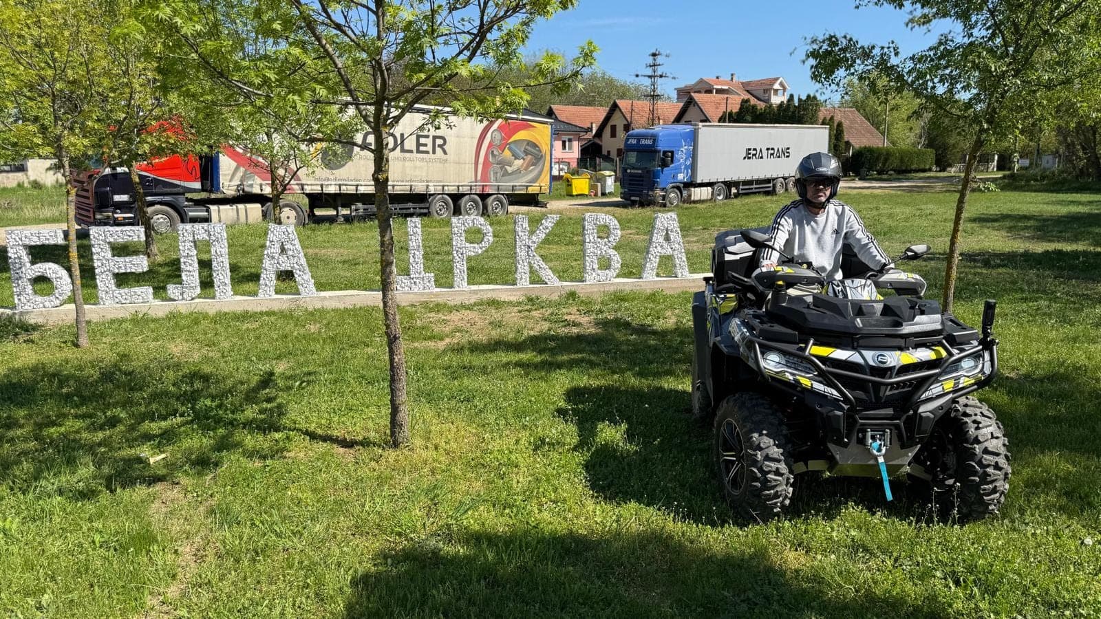 A Mad Max Quads rider at the Bela Crkva town sign in Serbia