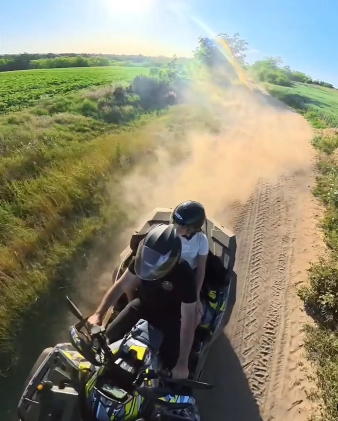 A quad bike kicking up a trail of dust on a countryside track near Bela Crkva