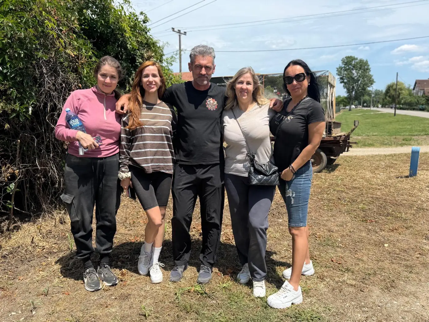 A tour group with their Mad Max guide after a quad bike ride in Bela Crkva